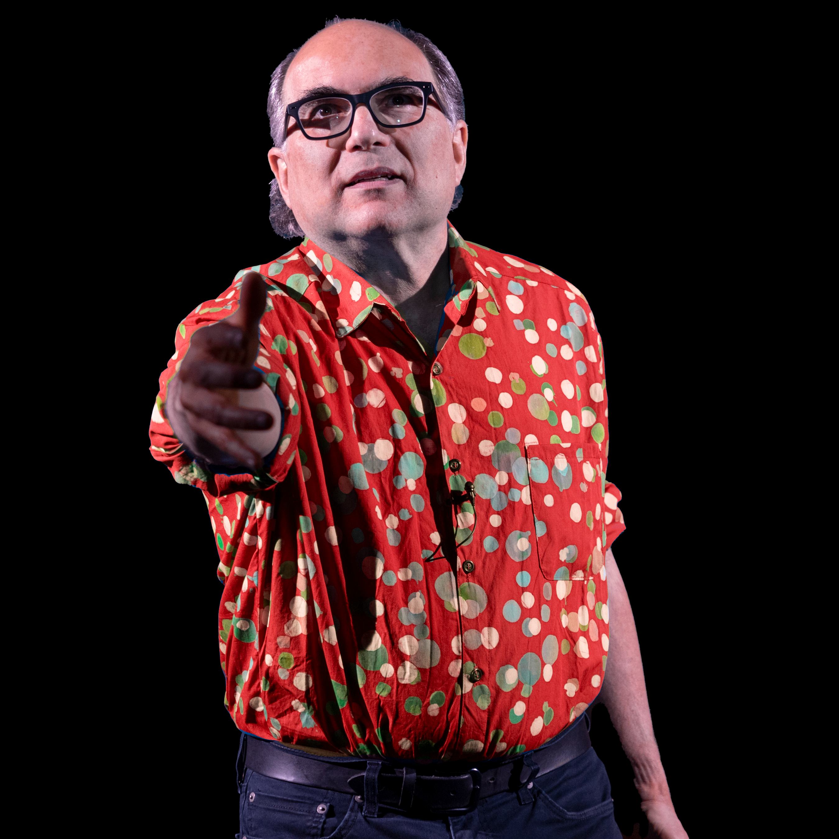 Josh in a red shirt with arm reached toward viewer